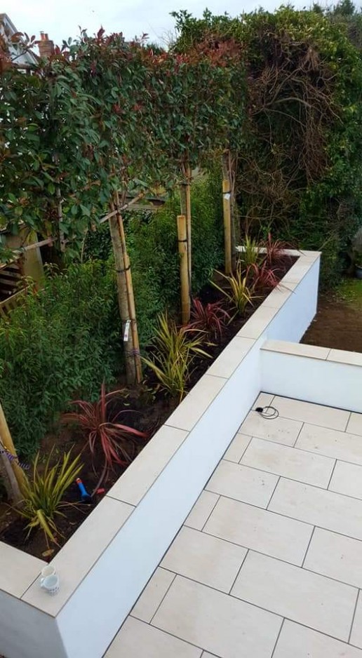 Flower beds made from white tiles