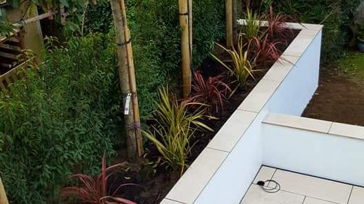 Flower beds made from white tiles