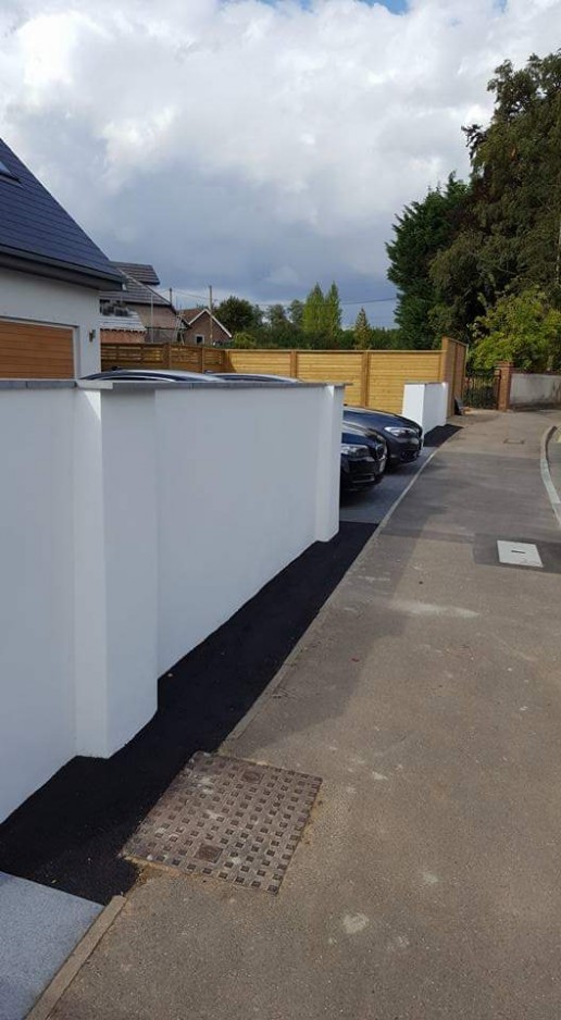 White brick wall & flower bed